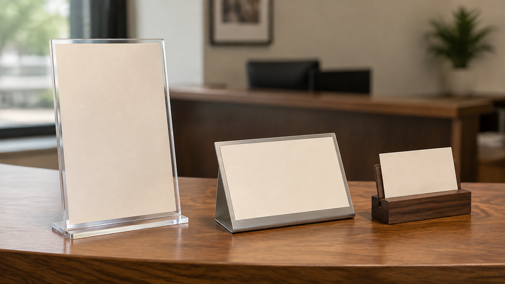 Three reception desk sign holder formats: a tall clear acrylic holder, a low angled metal holder, and a compact wood slot stand