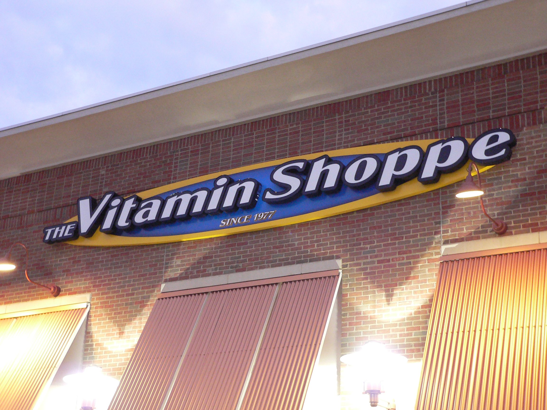 Illuminated channel letters installed across a business storefront