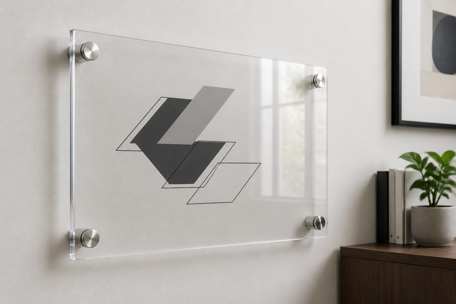 Clear acrylic sign mounted away from a painted indoor wall with four brushed-metal cylindrical standoffs